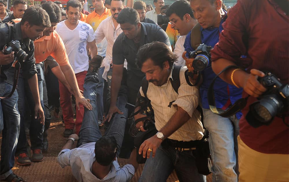 A photographer keeled over right in Bollywood cyclone SALMAN KHAN'S path at the Western Railway sports ground in Mahalaxmi. No casualties reported. Pic Courtesy: DNA