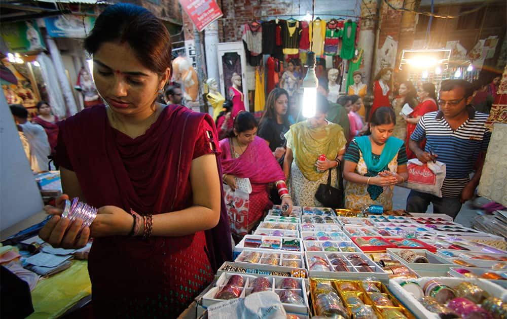 Women shop for bangles on the eve of Karwa Chauth festival in Jammu.