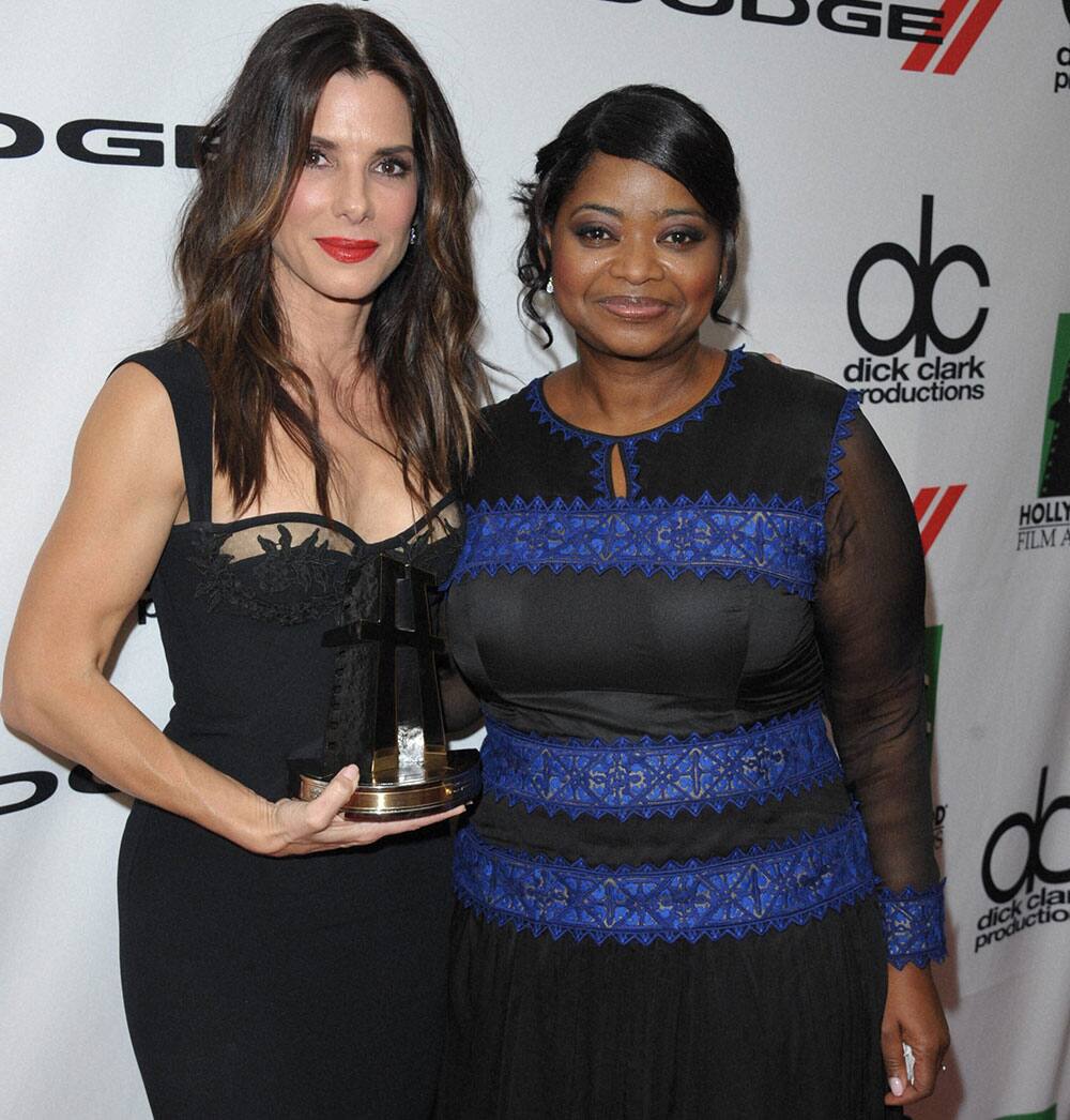 Hollywood actress and award winner Sandra Bullock, left, and Octavia Spencer pose backstage at the 17th Annual Hollywood Film Awards Gala at the Beverly Hilton Hotel in Beverly Hills, Calif. 