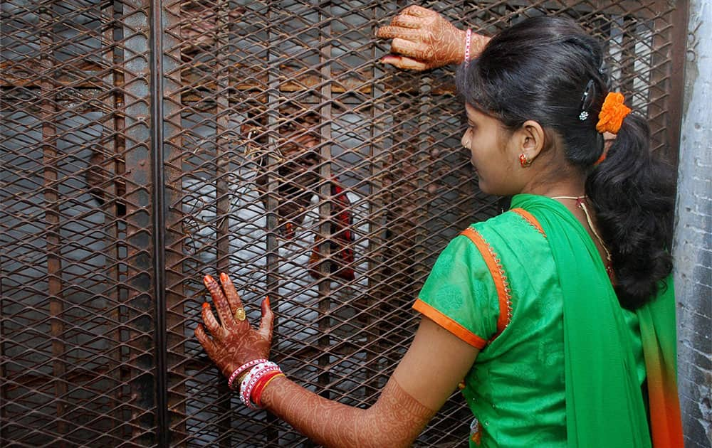 A woman meeting her husbands who is a prisoner in Central Jail Amritsar as jail authorities made spacial arrangements on the occasion of ‘Karva Chauth' in Amritsar.