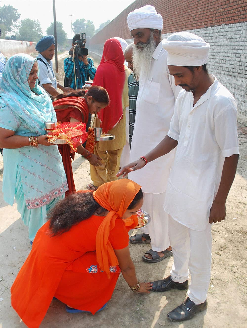 Women meeting their husbands who are prisoners in Central Jail Amritsar as jail authorities made spacial arrangements on the occasion of ‘Karva Chauth' in Amritsar.