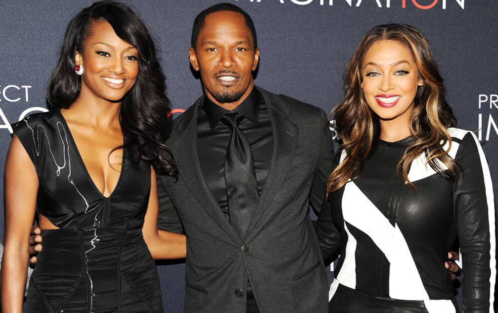 Actors Nichole Galicia, Jamie Foxx and La La Anthony attend the global premiere of Canon's 