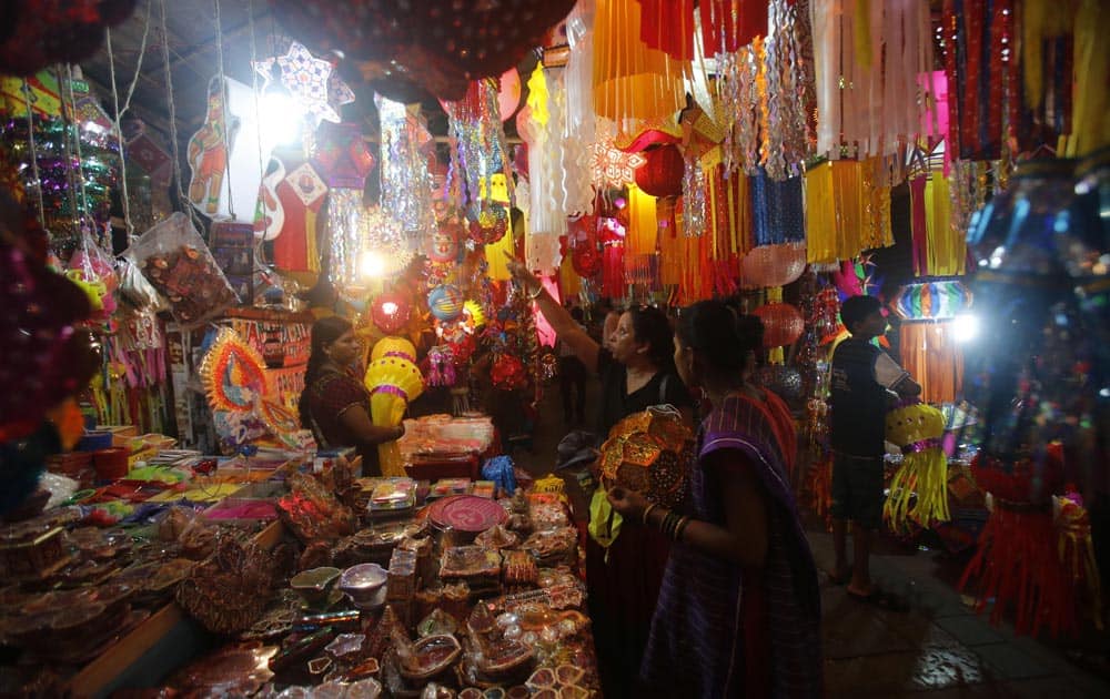 People buy lanterns from roadside stalls ahead of Hindu festival of lights Diwali, in Mumbai.