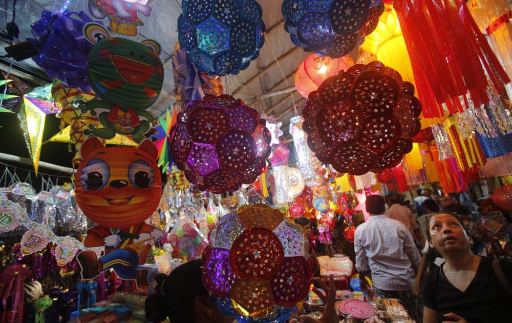 People buy lanterns from roadside stalls ahead of Hindu festival of lights Diwali, in Mumbai.