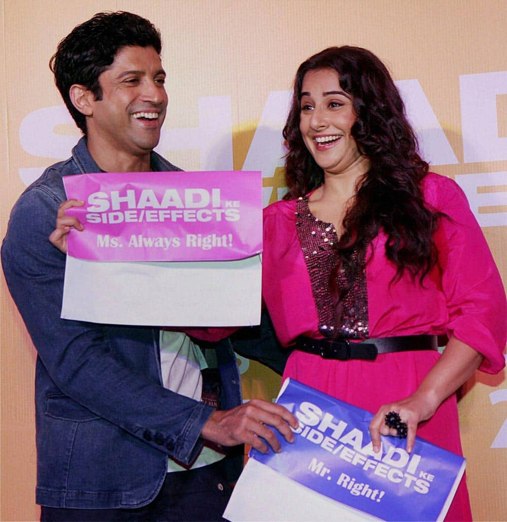 Bollywood actors Vidya Balan Kapur and Farhan Akhtar pose during the first look of their upcoming film 'Shaadi Ke Side Effects' in Mumbai.