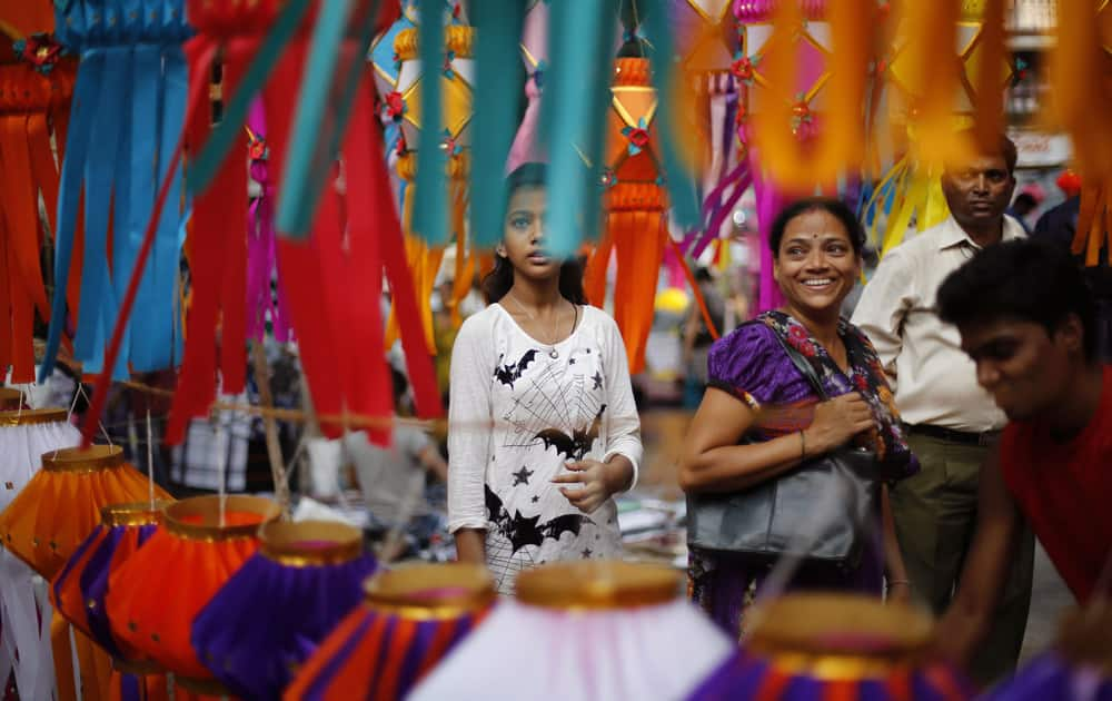 People shop for lanterns at a roadside stall ahead of Diwali in Mumbai.