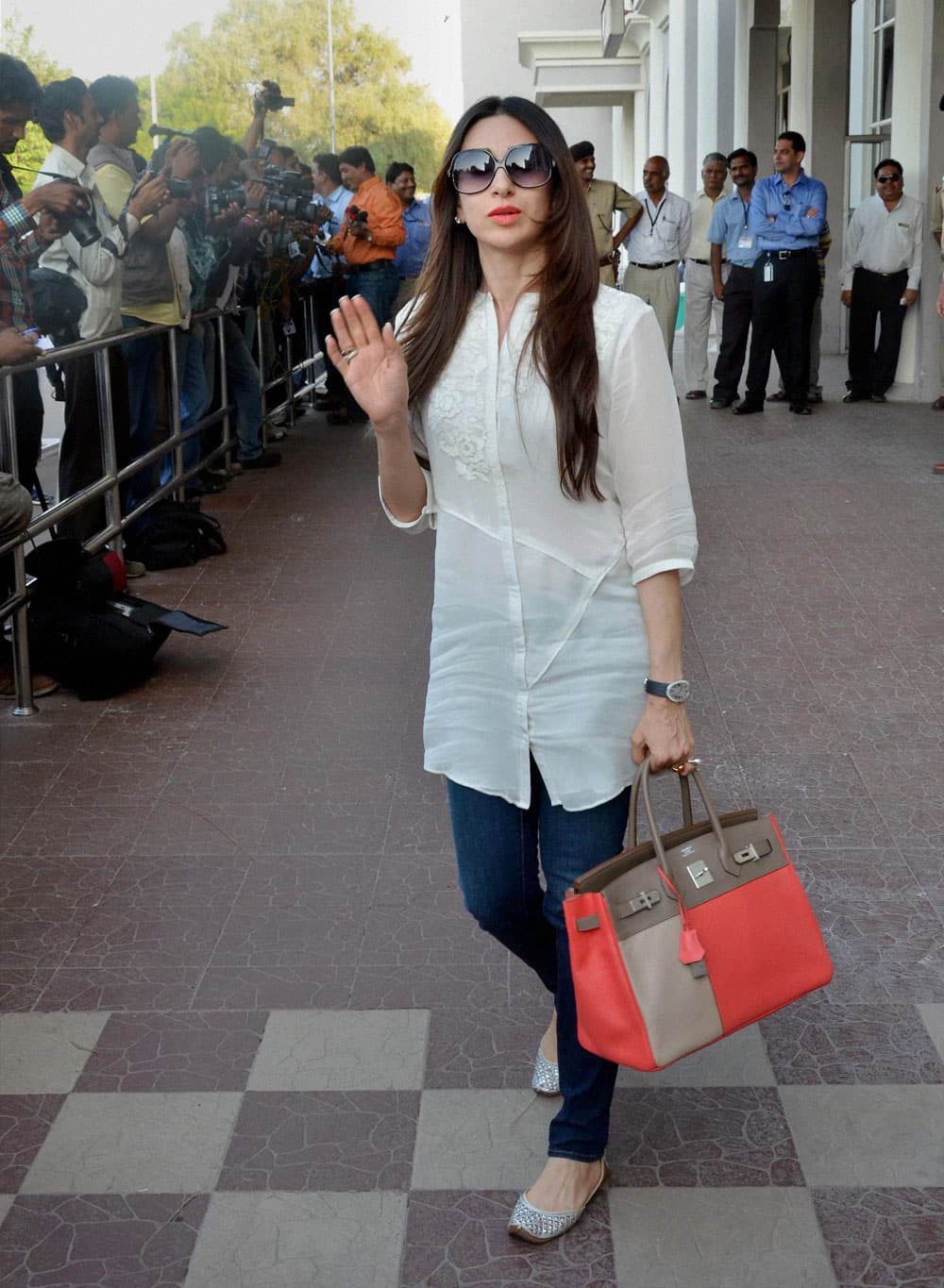 Karishma Kapoor arrives at the airport in Jodhpur on Thursday to attend Nita Ambani's 50 birthday bash.