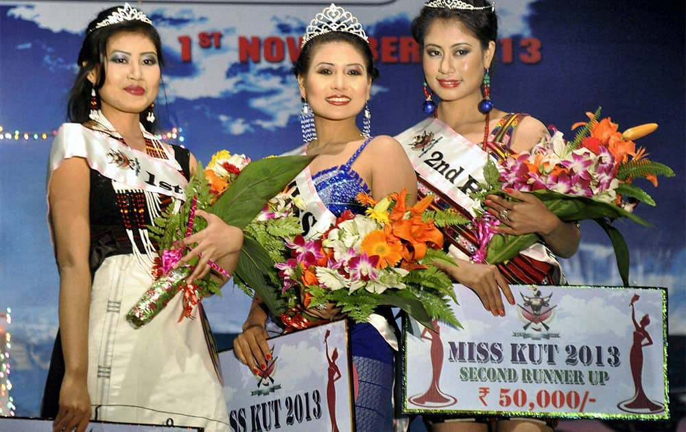 Miss Kut 2013 winners, from left 1st runner-up Salam Kalpana (L), winner Lingjanei Kipgen and 2nd runner-up Chakpram Purnima pose for photographs in Imphal.