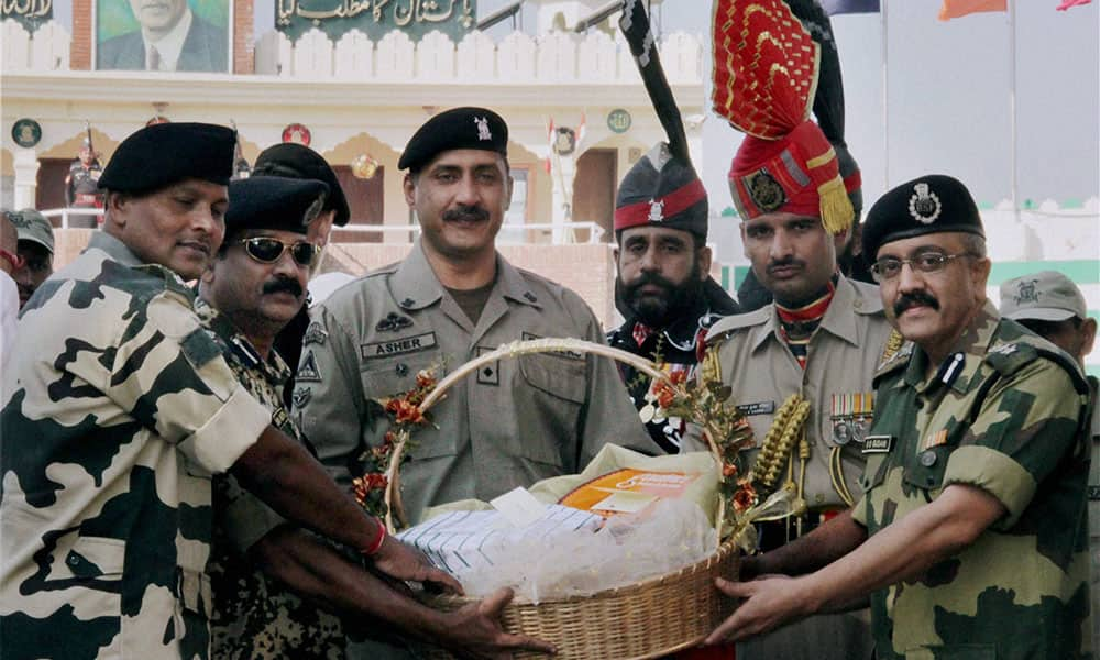 BSF Officials presenting sweet basket to Pakistan Ranger Official on the occasion of Diwali at Amritsar.