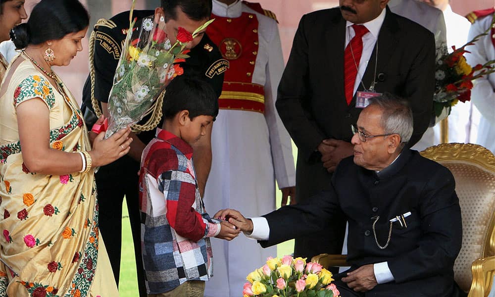 President Pranab Mukherjee being greeted by children on the occasion of Diwali at Rashtrapati Bhawan in New Delhi.