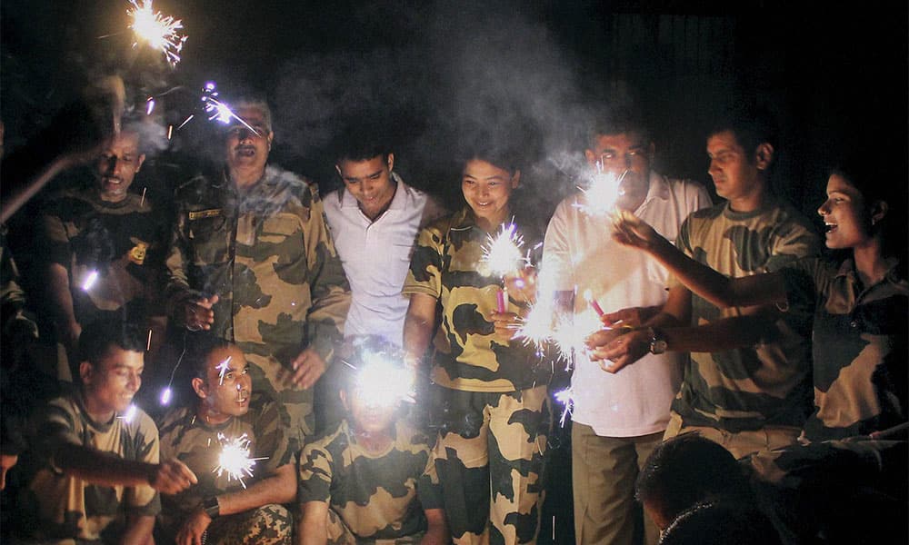 Border Security Force jawans celebrating Diwali by lighting crackers at the India-Bangladesh border in South Dinajpur district of West Bengal.