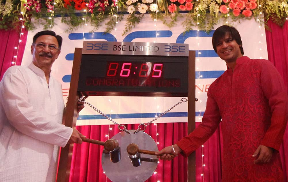 Bollywood actors Suresh Oberoi and Vivek ringing the bell during the Muhurat trading in Mumbai.