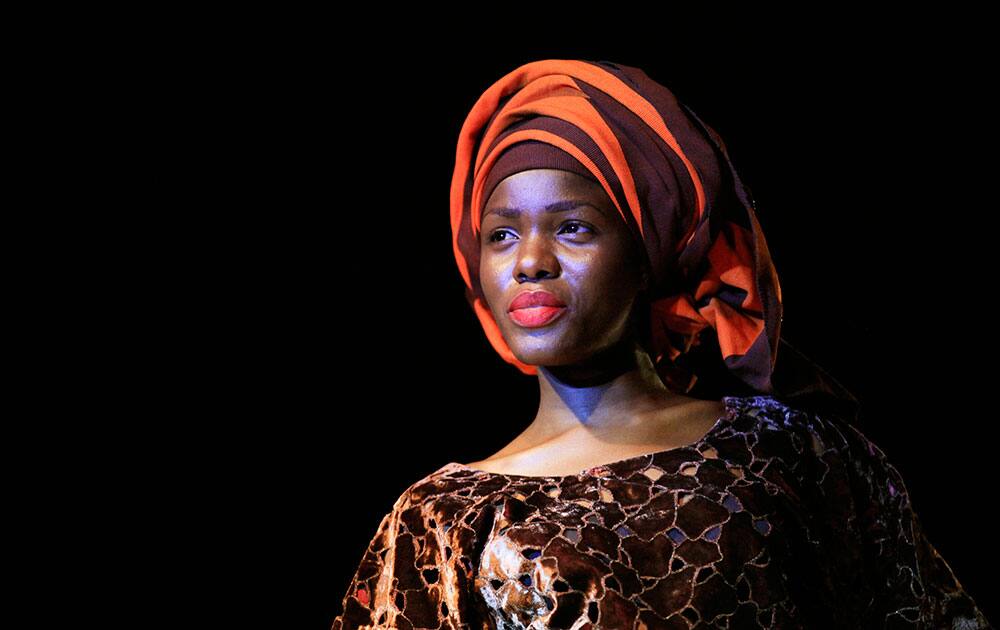 An ISIS model displays an outfit by Deola Sagoe during an event to mark the 10-year anniversary of the death of the fashion designer's late mother Elizabeth Wuraola Ojo, in Akure, Nigeria.