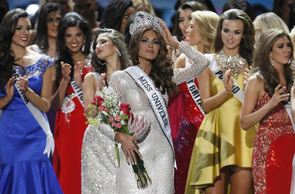 Miss Universe 2013 Gabriela Isler, from Venezuela, adjusts her crown after winning the 2013 Miss Universe pageant in Moscow.