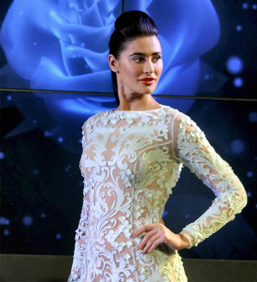 Bollywood actress Nargis Fakhri walks the ramp at a fashion show in Kolkata.