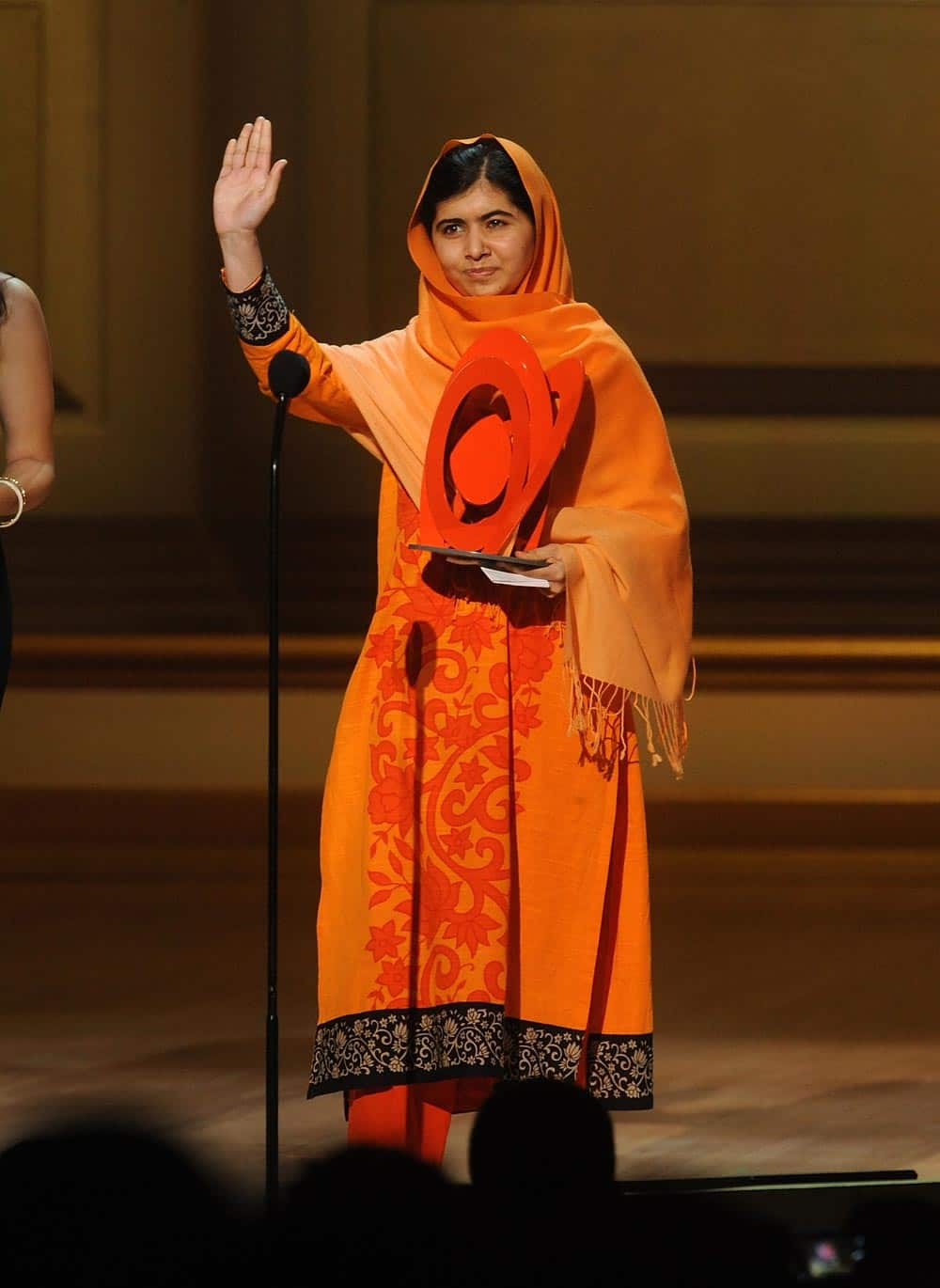 Education activist Malala Yousafzai accepts The Women of the Year Fund Honoree Award on stage at the 2013 Glamour Women of the Year Awards, in New York.