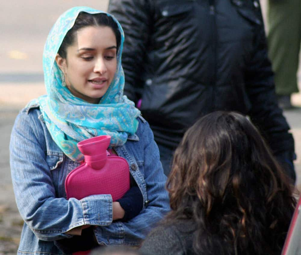 Shraddha Kapoor warms herself with hot water bottle during shooting of the film 'Haider' at Qazigund in J & K.