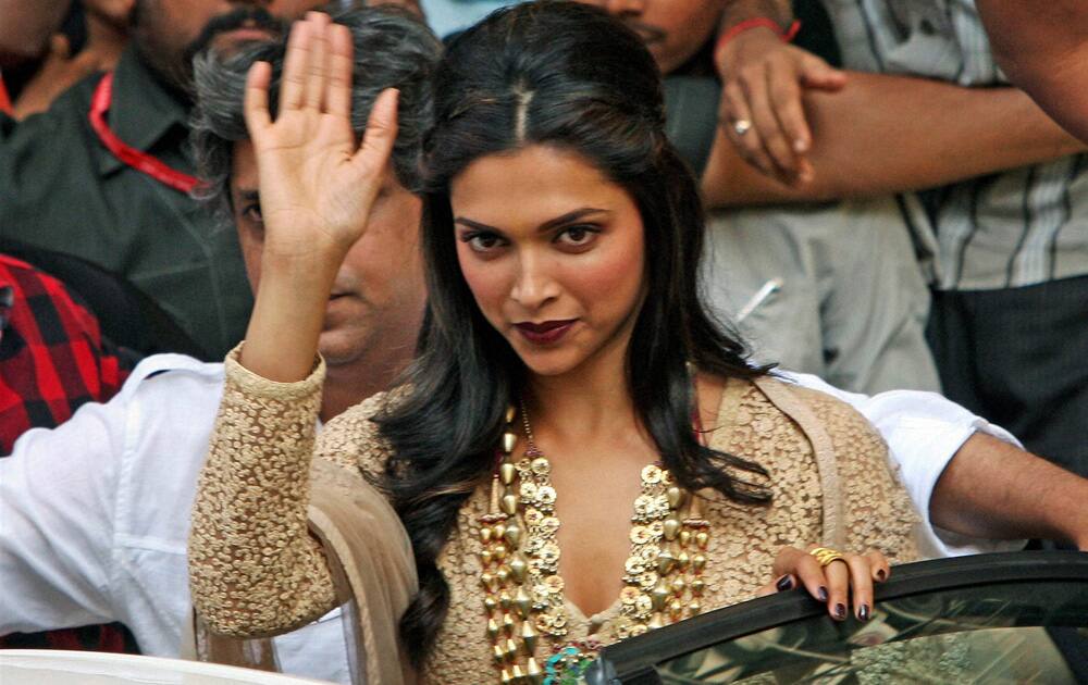 Deepika Padukone wave to her fans during the promotion of her upcoming film Ram-Leela in Kolkata.