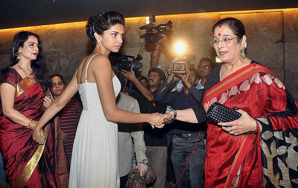 Bollywood actors Rekha and Deepika Padukone with Poonam Sinha during the screening of film Ram Leela in Mumbai.