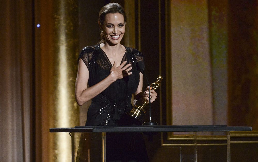 Actress and honoree Angelina Jolie accepts her award at the 2013 Governors Awards in Los Angeles.