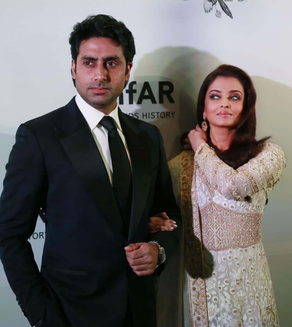 Bollywood actors Abhishek Bachchan, left, and Aishwarya Rai Bachchan pose as they arrive at the amfAR (The Foundations for AIDS research) India’s inaugural fundraising gala in Mumbai, India.