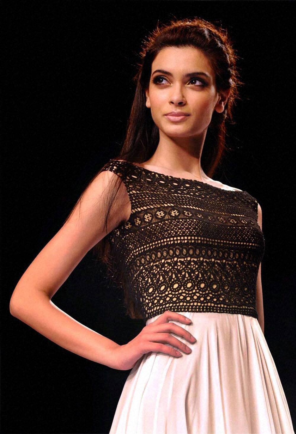 Bollywood actress Diana Penty walks the ramp at Signature International Fashion Week 2013 in Mumbai.