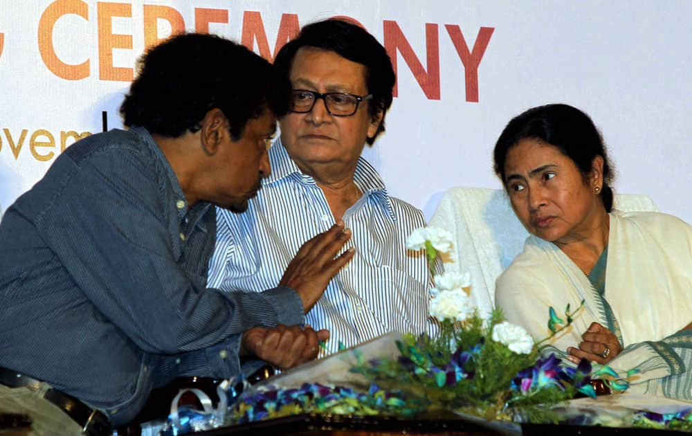 West Bengal Chief Minister Mamata Banerjee, noted Director Goutam Ghosh (L) and actor Ranjit Mullick during Kolkata International Film Festival closing ceremony in Kolkata.