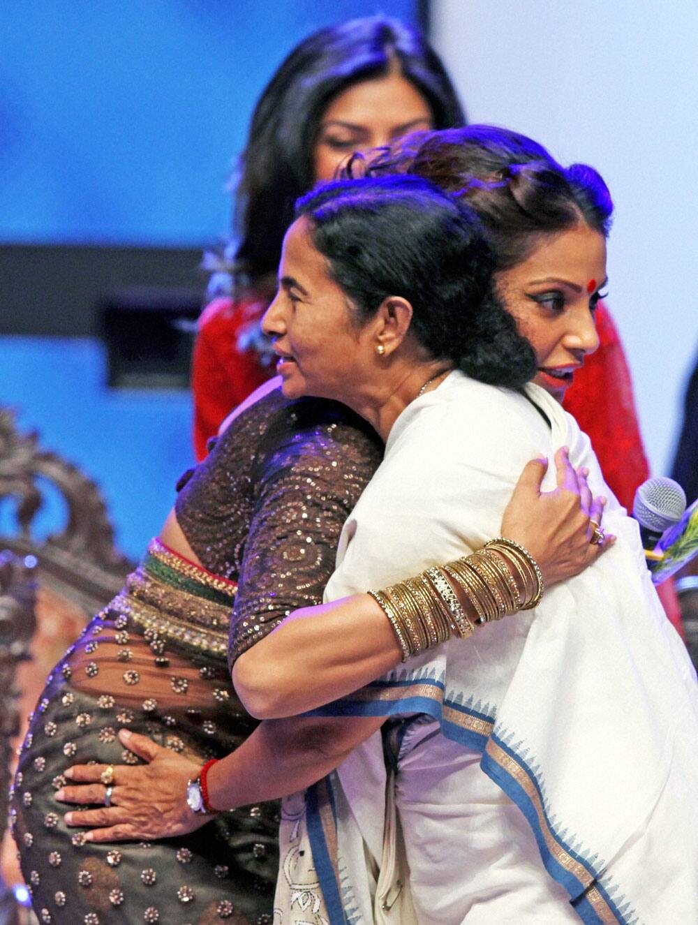 West Bengal Chief Minister Mamata Banerjee hugs Bollywood actress Bipasha Basu during closing ceremony of 19th Kolkata International Film Festival in Kolkata.