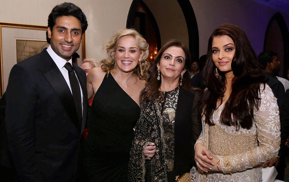 Abhishek Bachchan, Sharon Stone, Neeta Ambani and Aishwarya Rai Bachchan at the amfAR event in Mumbai.