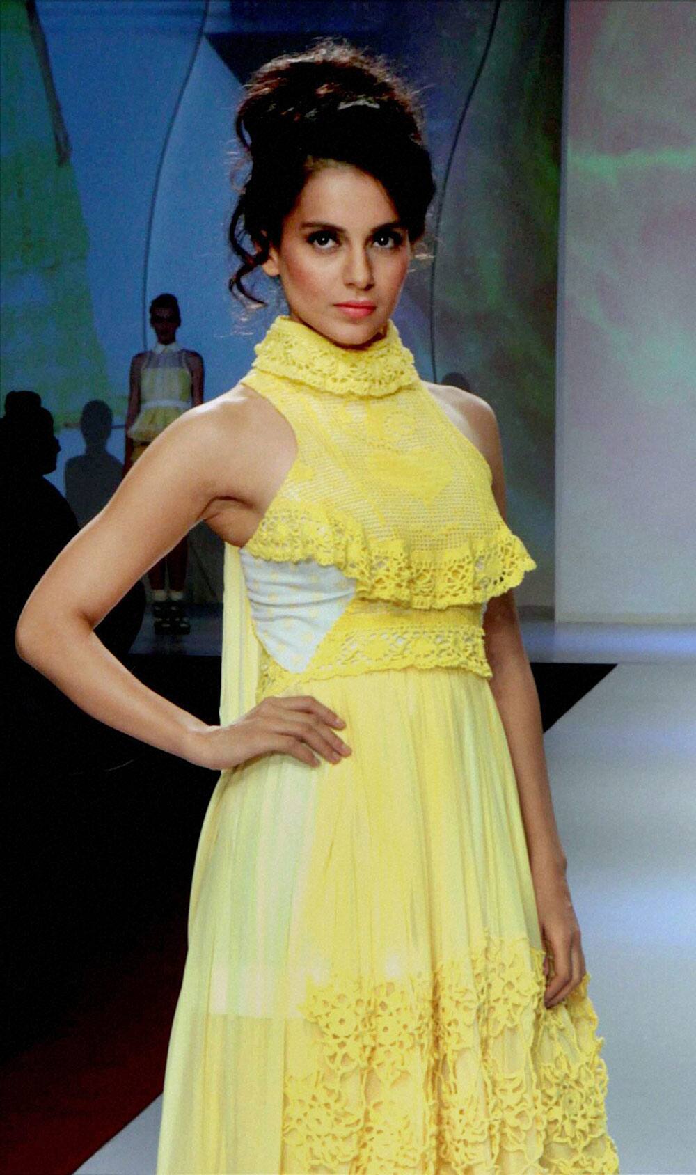 Bollywood Actress Kangana Ranaut walks the ramp at the Signature International Fashion Weekend 2013 in Mumbai.