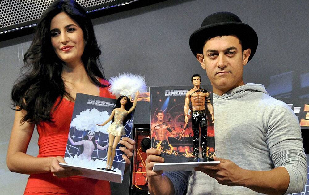 Bollywood actors Aamir Khan and Kaitrena Kaif during the launch of first ever Indian celebrity dolls based on their characters, Sahir and Aliya, in their upcoming movie Dhoom 3 in Mumbai.