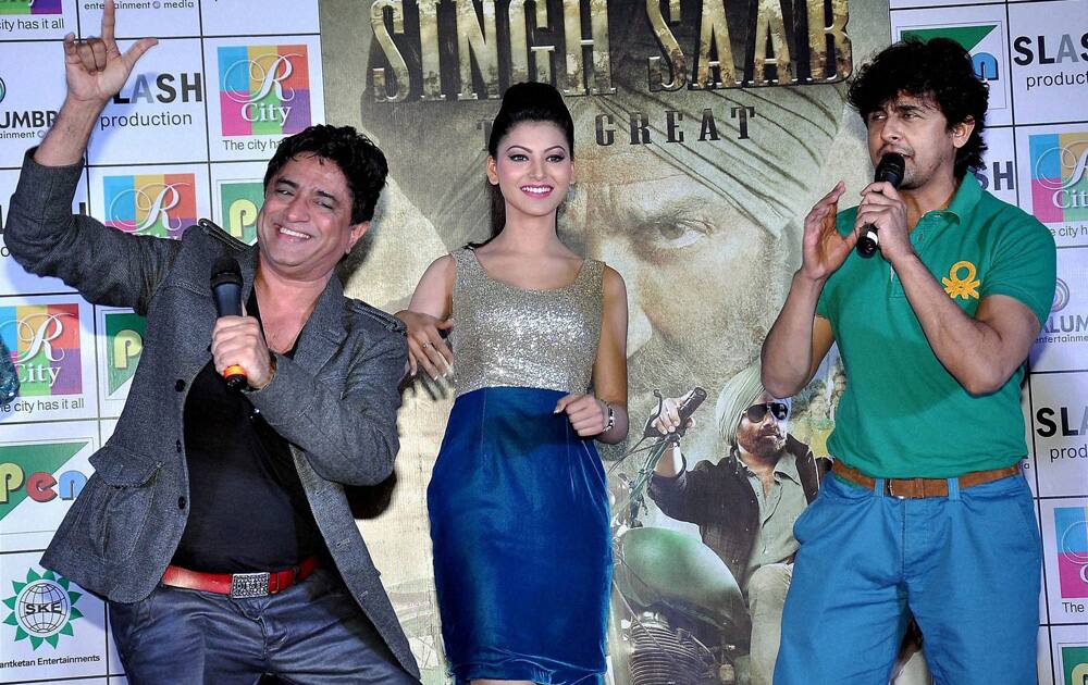 Actress Urvashi Rautela with Music Director Anand Raj Anand and singer Sonu Nigam during a promotional event for their upcoming film.