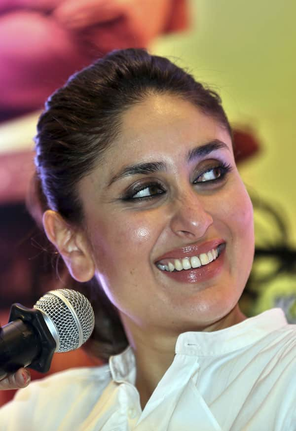 Bollywood actor Kareena Kapoor Khan smiles as she listens to her fellow actor Imran Khan during a press conference organized to promote her forthcoming movie Gori Tere Pyaar Mein (My Fair Lady, In Your Love) in Bangalore.