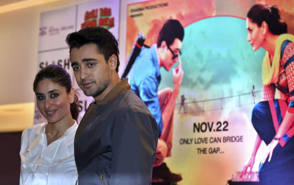 Bollywood actors Kareena Kapoor Khan, left, and Imran Khan pose for photographs after a press conference organized to promote her forthcoming movie Gori Tere Pyaar Mein, in Bangalore.