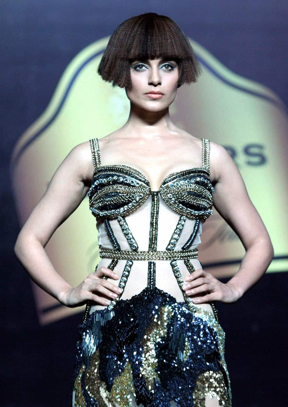 Bollywood Actress Kangana Ranaut displays Designer Gaviin Miguel's creation during a Fashion show, in Mumbai.