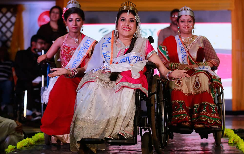 Nirmala, centre, smiles after being named Miss Wheelchair India Beauty during a beauty contest in Mumbai, India. 15 handicapped contestants took part in the event.