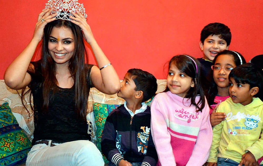 Miss Asia Pacific World 2013 India's Srishti Rana who has been crowned in Busan South Korea recently, at her residence in Faridabad, Haryana on Sunday. Srishti.