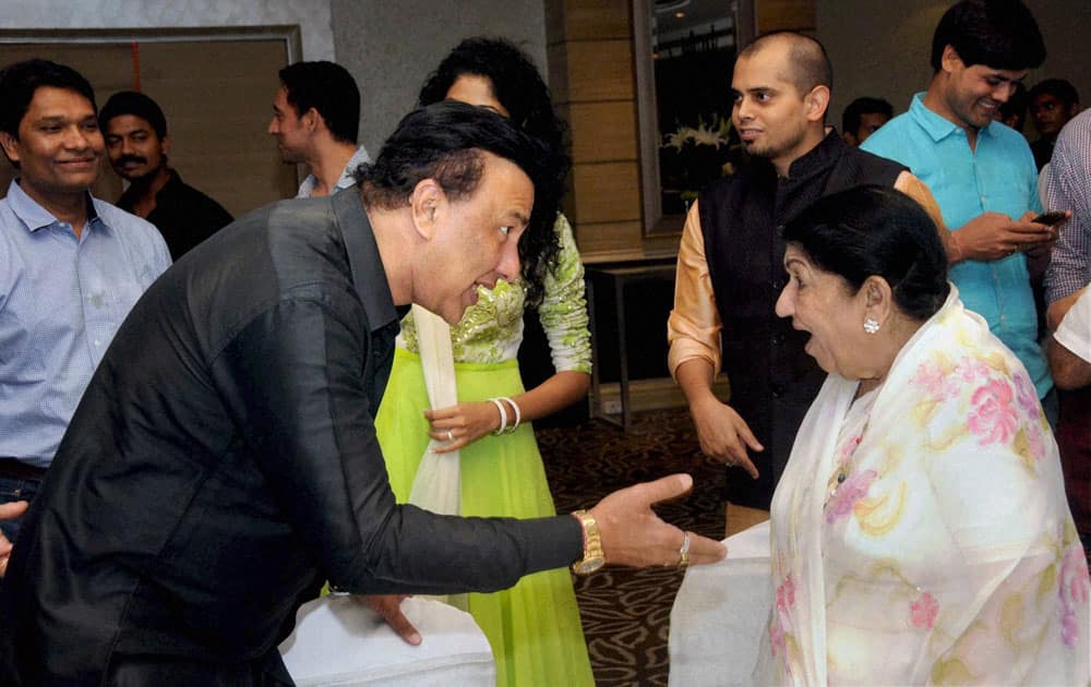 Lata Mangeshkar (R) with music director Anu Mallik during an event in Mumbai.