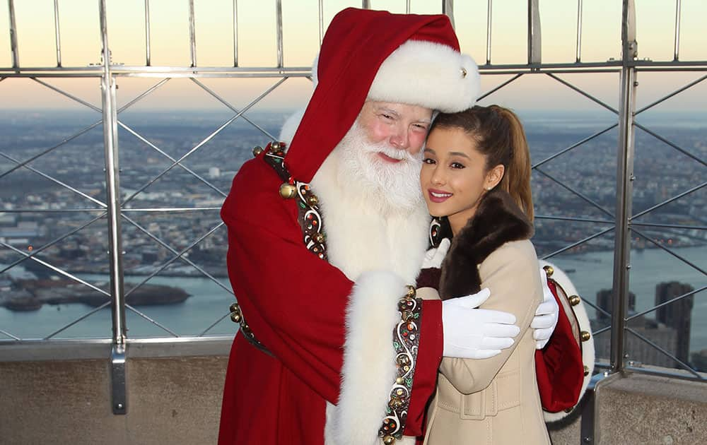 Santa Claus and singer Ariana Grande are seen at the Empire State Building Lighting where they officially kick-off Macy's Thanksgiving Day Parade week  in New York. 