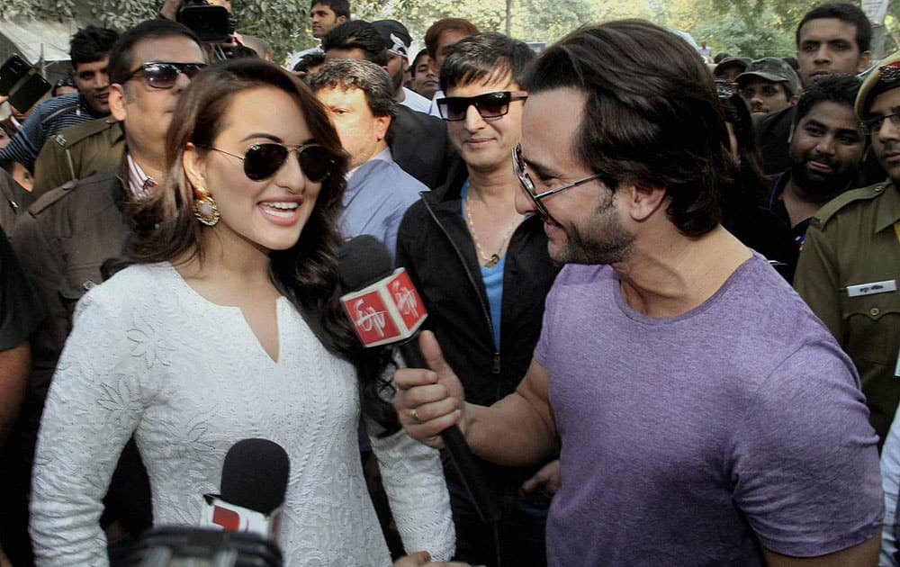 Actor Saif Ali Khan interviews Sonakshi Sinha as actor Jimmy Shergill looks on, at a voting awareness campaign in New Delhi.