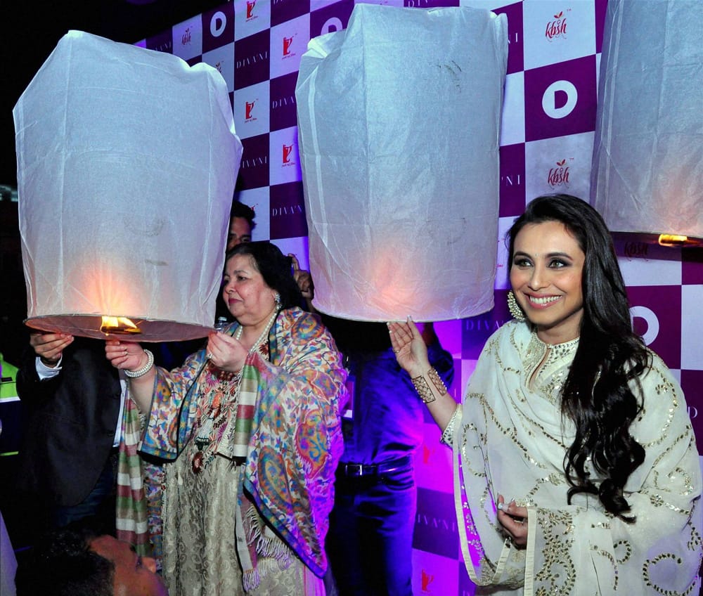 Rani Mukherjee and Pamela Chopra light wishing lanterns at a promotional event in New Delhi.