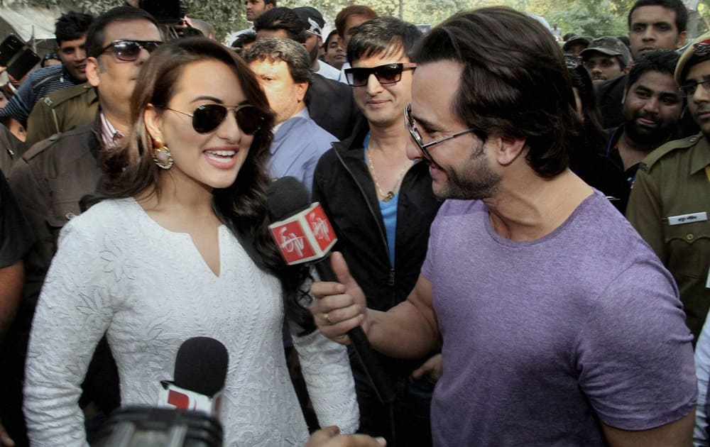 Actor Saif Ali Khan interviews Sonakshi Sinha as actor Jimmy Shergill looks on, at a voting awareness campaign in New Delhi.