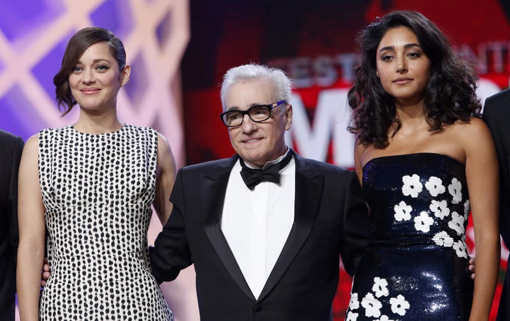 Jury members, French actress Marion Cotillard and US film director Martin Scorsese and Iranian actress Golshifteh Farahani, right, pose during the opening ceremony at the Marrakech International Film Festival in Marrakech.