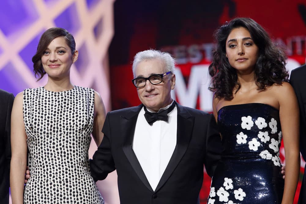 Jury members, French actress Marion Cotillard and US film director Martin Scorsese and Iranian actress Golshifteh Farahani, pose during the opening ceremony at the Marrakech International Film Festival.