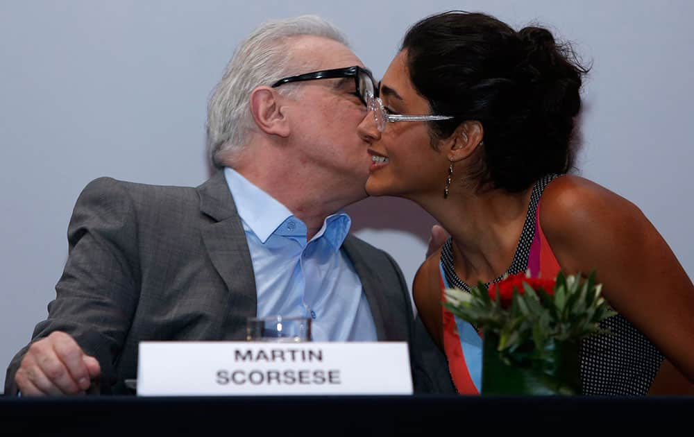 President of the jury of the Marrakech International Film Festival, left, US film director Martin Scorsese, left, kisses Iranian actress and jury member Golshifteh Farahani, during a news conference at the Marrakech International Film Festival in Marrakech, Morroco.