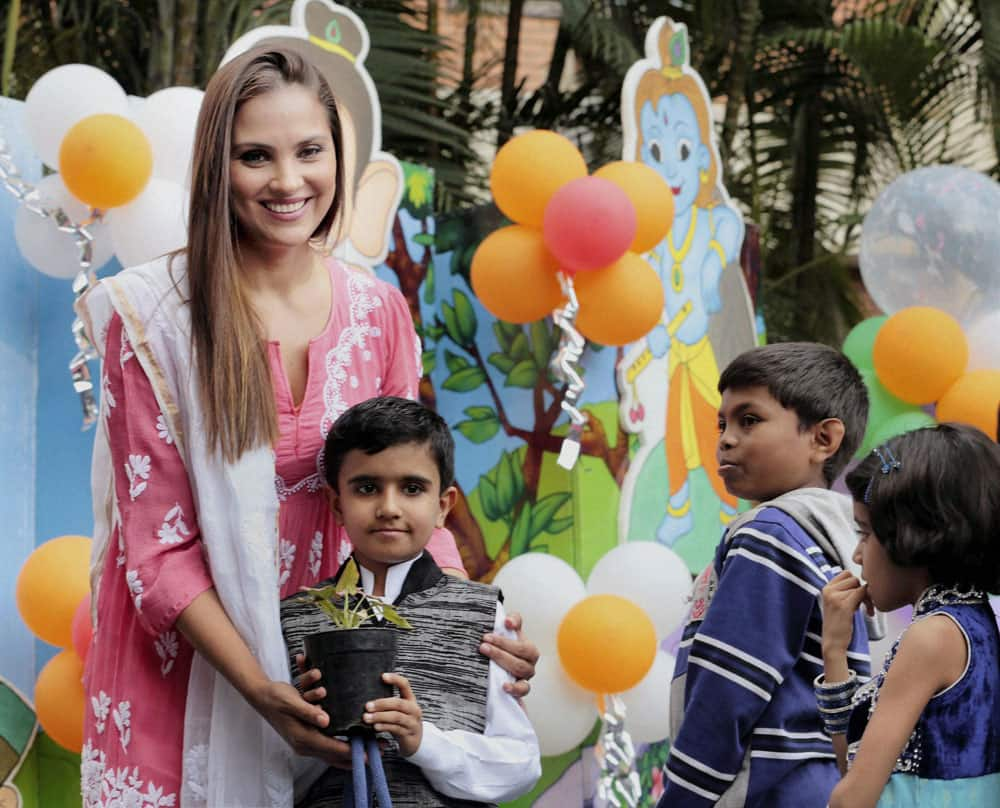 Actor Lara Dutta along with children suffering from cancer at the launch of a campaign against cancer in Bengaluru.