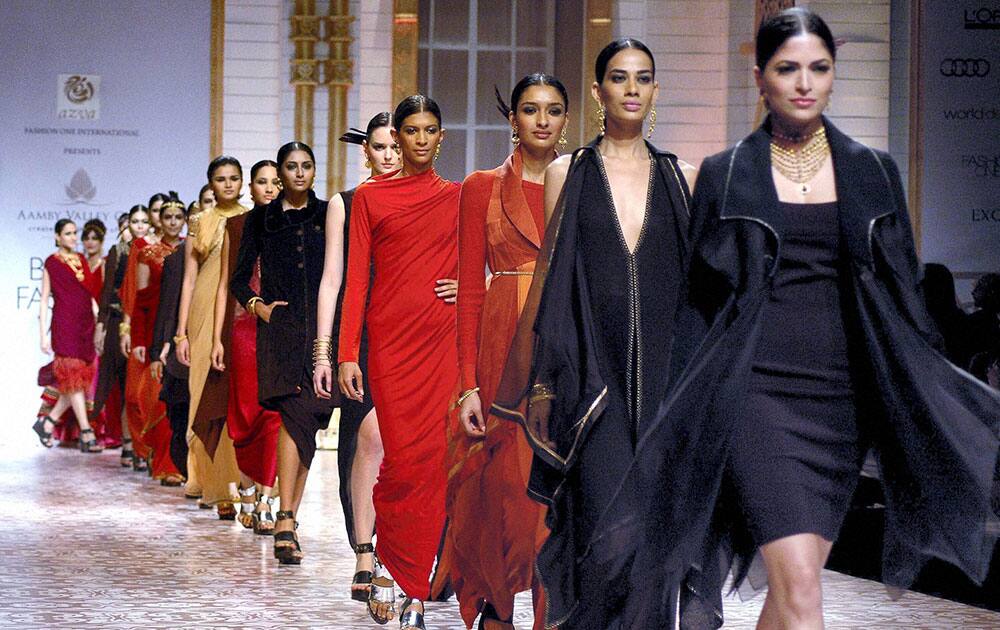 Models walk the ramp showcasing outfits designed by Azva during the Aamby Valley India Bridal Fashion Week on third day.