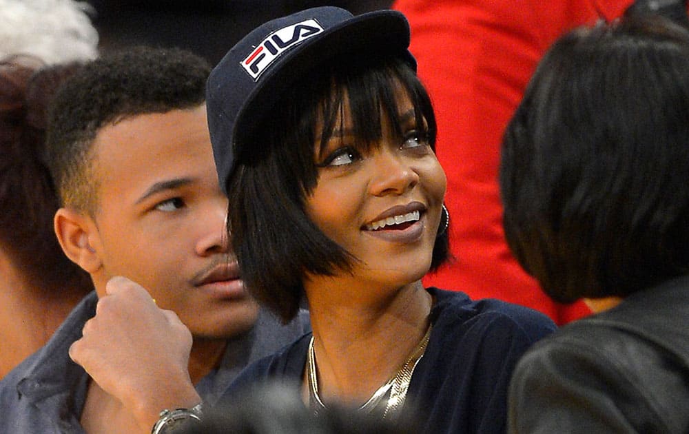 Singer Rihanna, watches the Los Angeles Lakers play the Portland Trail Blazers in an NBA basketball game, in Los Angeles.