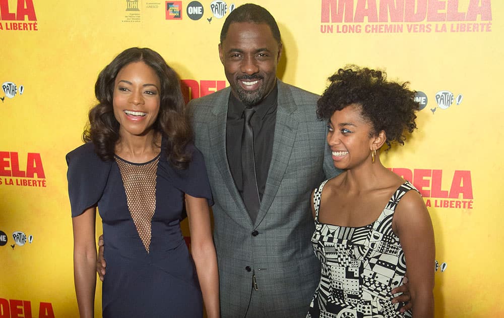 British actors Naomie Harris, left, Idris Elba, center, and Lindiwe Matshikiza pose during a photocall prior to a screening of the film `Mandela: Long Walk to Freedom` at the UNESCO headquarters in Paris.