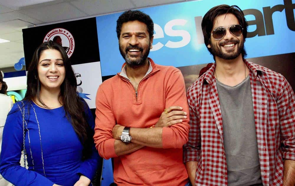 Bollywood actors Shahid Kapoor and Charmi with Director Prabhu Deva during a promotional event for their upcoming film 'R... Rajkumar' in Hyderabad.